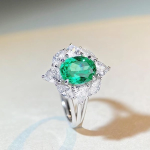 Exquisite S925 silver ring featuring an oval green gemstone with marquise diamond accents