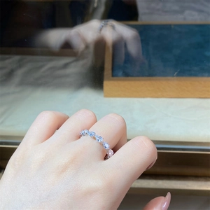 Macro detail of S925 sterling silver ring with pear-cut teardrop cubic zirconia settings