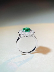 Macro shot of S925 sterling silver stamp and oval green gemstone on sunflower ring
