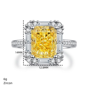Macro view of a 14mm radiant cut yellow zircon ring with silver halo and pave accents
