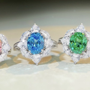 Macro detail of S925 silver rings with colorful oval gemstones and marquise side stones