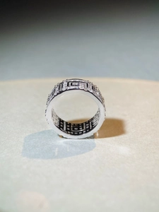 Detailed macro shot of S925 sterling silver Greek key ring with pavé-set cubic zirconia