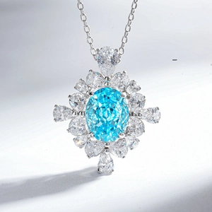 Elegante collana in argento S925 con gemma blu ovale e ciondolo a forma di fiore