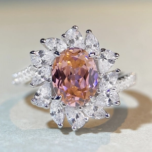 Luxurious flower-shaped S925 silver ring with oval pink gemstone and pear-cut accents