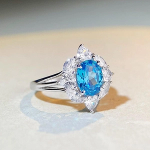 S925 sterling silver ring with oval aquamarine center stone and floral zircon cluster