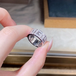 Close-up of S925 sterling silver ring with geometric cutout design and paved zircons