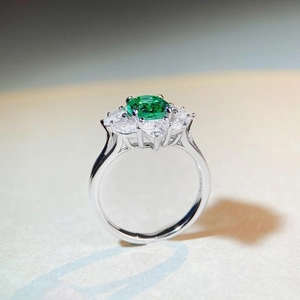 Elegant S925 silver ring with oval green gemstone and marquise diamond halo