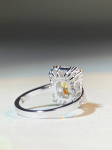 Close-up of S925 sterling silver ring featuring a yellow cushion-cut halo zircon stone