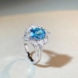 Original design S925 silver ring featuring oval blue gemstone and zircon cluster flowers