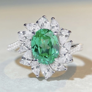 Luxurious S925 sterling silver ring with oval green gemstone and dazzling cubic zirconia