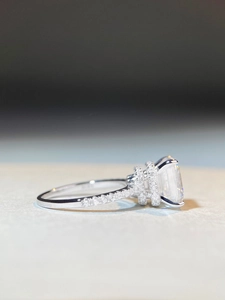 Detailed side view of S925 silver ring featuring Asscher cut moissanite with pavé setting