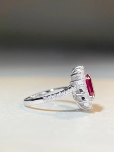 Detailed side view of S925 sterling silver ring with ruby main stone and pavé accents