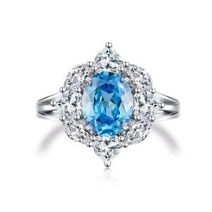 Elegant S925 sterling silver ring with oval aquamarine center and pear-cut zircon accents