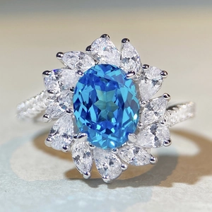 Elegant S925 silver flower ring featuring a large oval aquamarine zircon stone