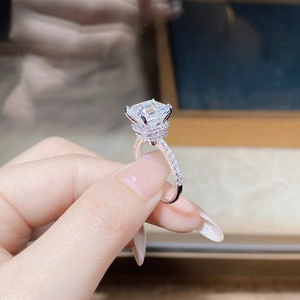 Detailed side view of Moissanite ring featuring Asscher cut stone and diamond pavé band