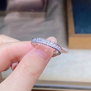 Detail of S925 sterling silver beaded ring with sparkling pave cubic zirconia accents