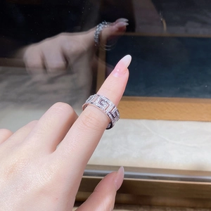 Close-up of S925 silver wide band ring featuring Greek Key pattern and pavé zircons