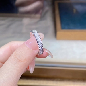 Macro shot of S925 sterling silver ring with pavé-set cubic zirconia and bead edges