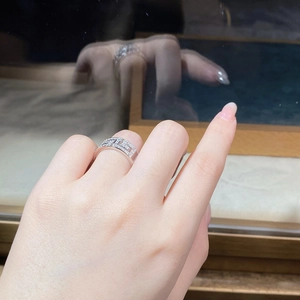 Detailed close-up of S925 sterling silver ring with geometric zircon pave settings