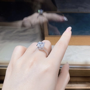 Detailed view of an Asscher cut moissanite ring with a micro-pave S925 silver band