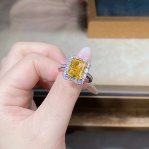 Close-up of S925 sterling silver ring with radiant yellow square cut gemstone