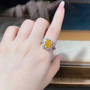 Detailed macro view of S925 silver ring featuring radiant cut yellow center stone