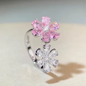 Adjustable S925 silver ring featuring two flowers with pink and white pear-cut zircons