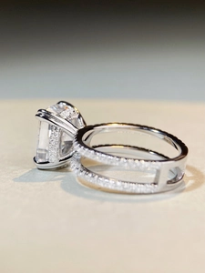 Close-up of S925 sterling silver ring with emerald cut zircon and pavé setting