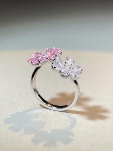 Macro detail of S925 sterling silver stamp and pink zircon flower design on the ring