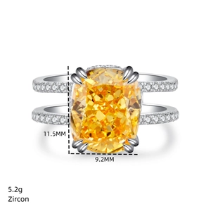 Detailed view of cushion cut yellow zircon ring with 11.5mm stone and paved silver band