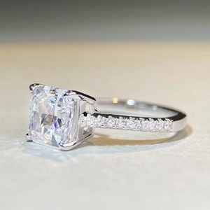 Classic S925 silver engagement ring featuring a radiant cut white zircon and pave band
