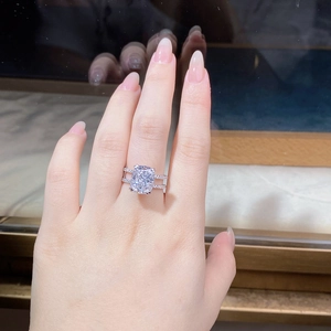 Macro shot of S925 sterling silver ring featuring double-row zircons and cushion cut stone
