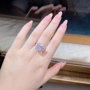Macro detail of a cushion-cut lilac gemstone ring with double-row diamond pavé band