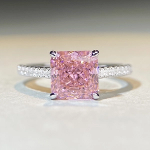 Macro shot of s925 silver ring with radiant cut pink gemstone and pavé diamonds