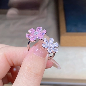 Detail of s925 silver open ring featuring pink and white pear-cut cubic zirconia flowers