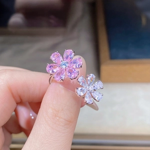 Close-up of adjustable S925 silver ring with pink pear-cut zircon floral petals