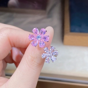 Macro shot of S925 silver ring featuring pink and white pear-cut floral zircon stones