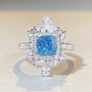Elegant S925 sterling silver ring with radiant blue gemstone and halo of clear zircons