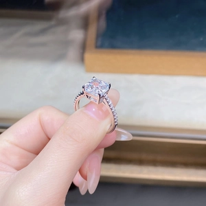 Macro shot of 925 silver engagement ring with radiant cut cz and pave set stones