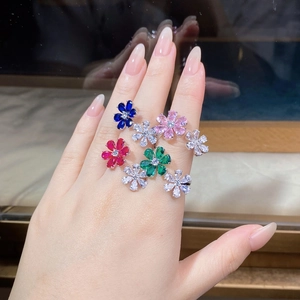 Detailed view of S925 silver flower rings set with colorful teardrop cut zircons on hand