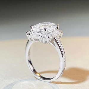 Elegant silver halo ring with radiant cut central stone and pavé set band