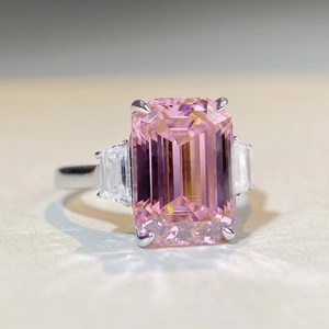 Three-stone 925 silver ring featuring emerald-cut pink zircon and side trapezoid stones