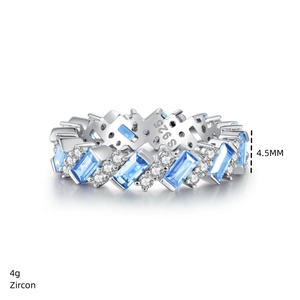 Macro detail of S925 sterling silver ring with blue rectangular zircon and round diamonds