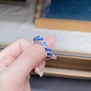 Macro shot of S925 sterling silver ring featuring rectangular blue and white gemstones