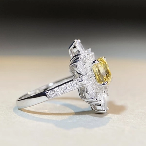 Elegant floral platinum-plated silver ring with oval yellow diamond and marquise stones