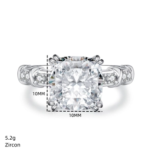Macro detail of 5.2g sterling silver cross ring featuring 10mm cushion-cut zircon stone