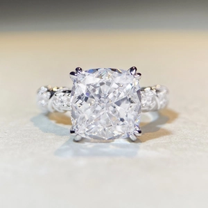 Cushion cut zirconia ring with twisted band and micro-pave setting in silver finish