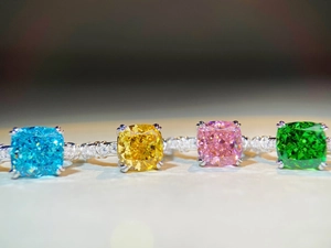 Macro shot of cushion-cut colorful zircon rings with shimmering micro-paved bands