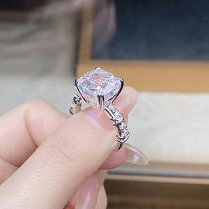 Macro view of a 925 silver cushion cut zircon ring with brilliant four-prong setting