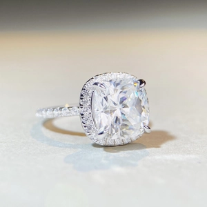 Elegant 5 carat cushion cut moissanite ring with halo setting on a silver band